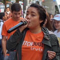 girl with microphone at rally