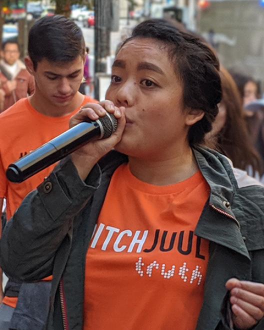 girl with microphone at rally