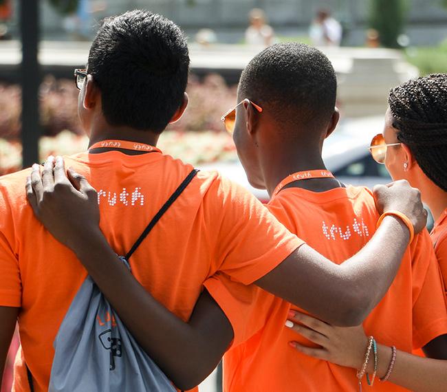 three young activists in truth shirts
