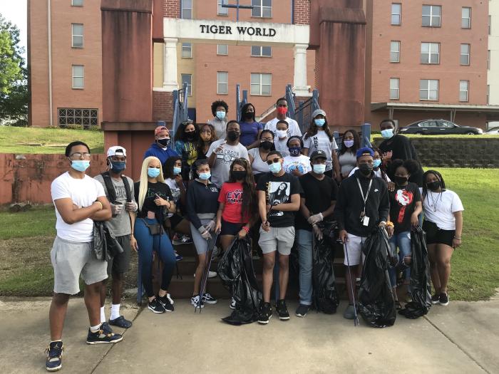 A photo of truth activists after participating in a cigarette and vape waste cleanup. Cigarettes and vapes can be hazardous to the environment.