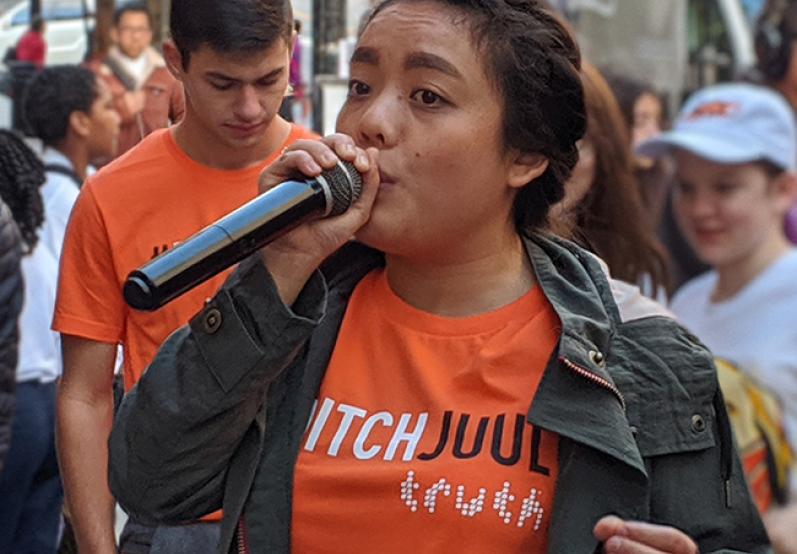 girl with microphone at rally